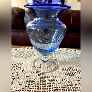 Gorgeous blue etched vase with pedestal. Measures 8”tall and 5” across the top.